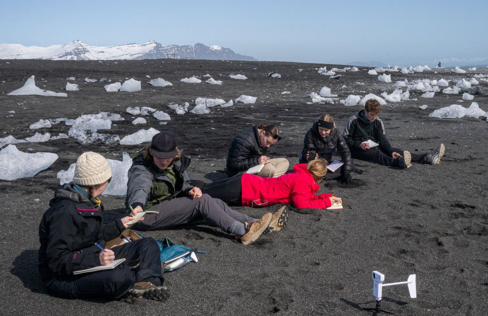 Students of 2026–2027 Advocate Alyson Saunders, Dexter Regional High School (Dexter, Maine), receiving instruction on how to make observations using their senses to enrich Pasco sensor data collection in a glacially influenced coastal environment. Diamond Beach, Iceland.
