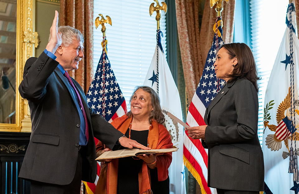 Vice President Kamala Harris (right) swears in former STS winner Eric Lander as the Director of the Office of Science and Technology Policy.