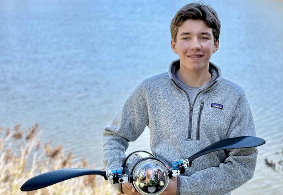 Evan Budz poses with his invention.