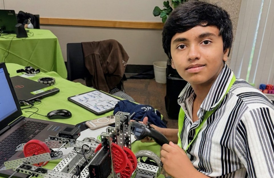 Siddharth Vazhkudai building his battle robot for his STEM summer experience.