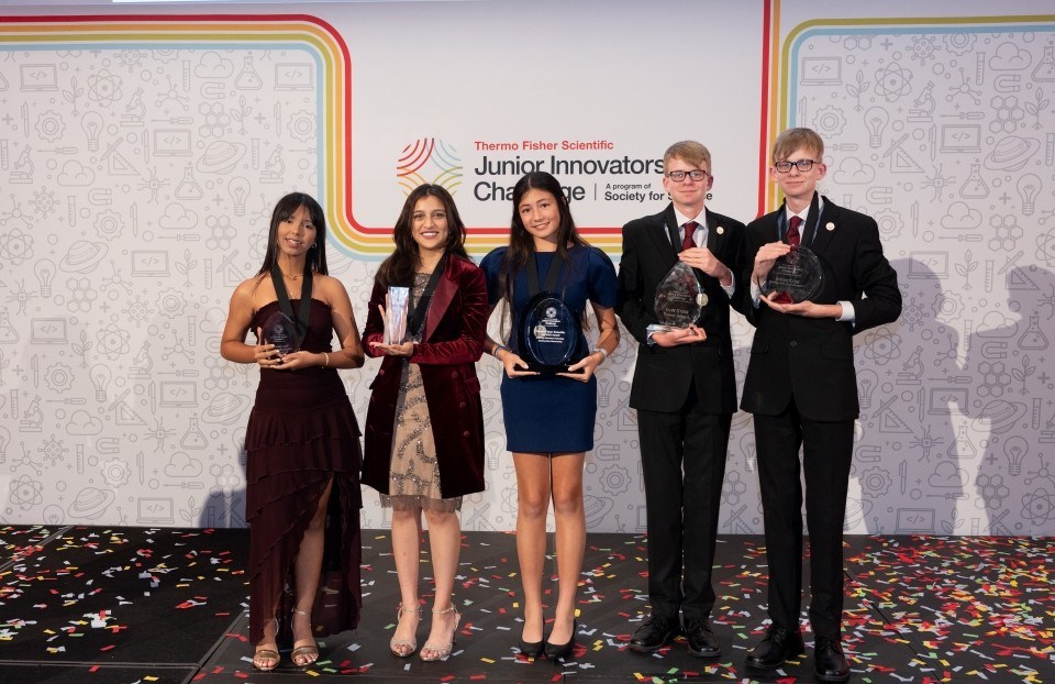 The top five Thermo Fisher JIC winners pose onstage with their awards.