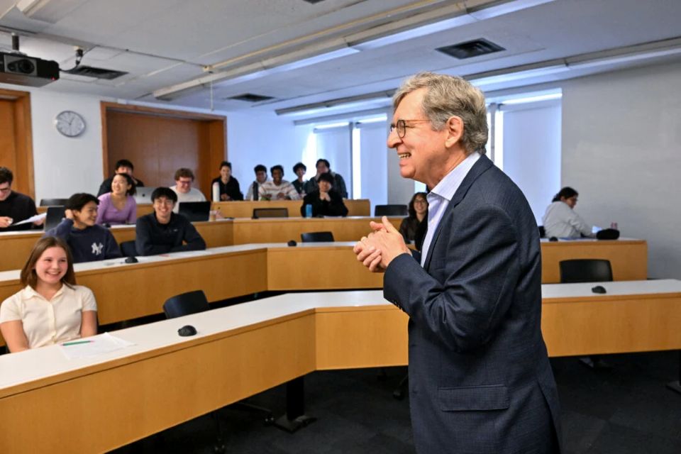Michael Woodford being welcomed and addressing students in class the day of the announcement of his economic sciences prize.